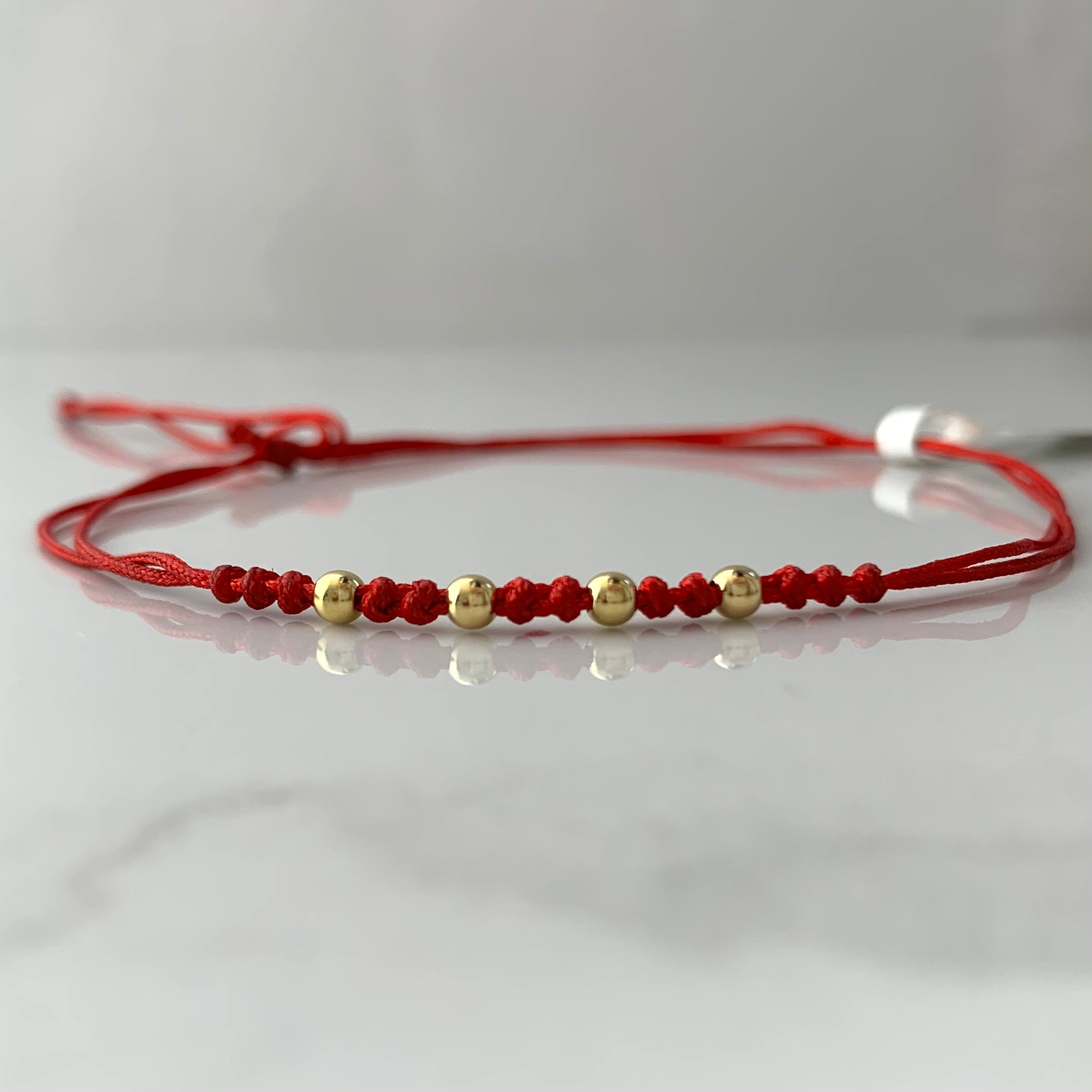 PULSERA TEJIDA ROJA BOLA LISA 3MM ORO AMARILLO 18K 0,2 GR