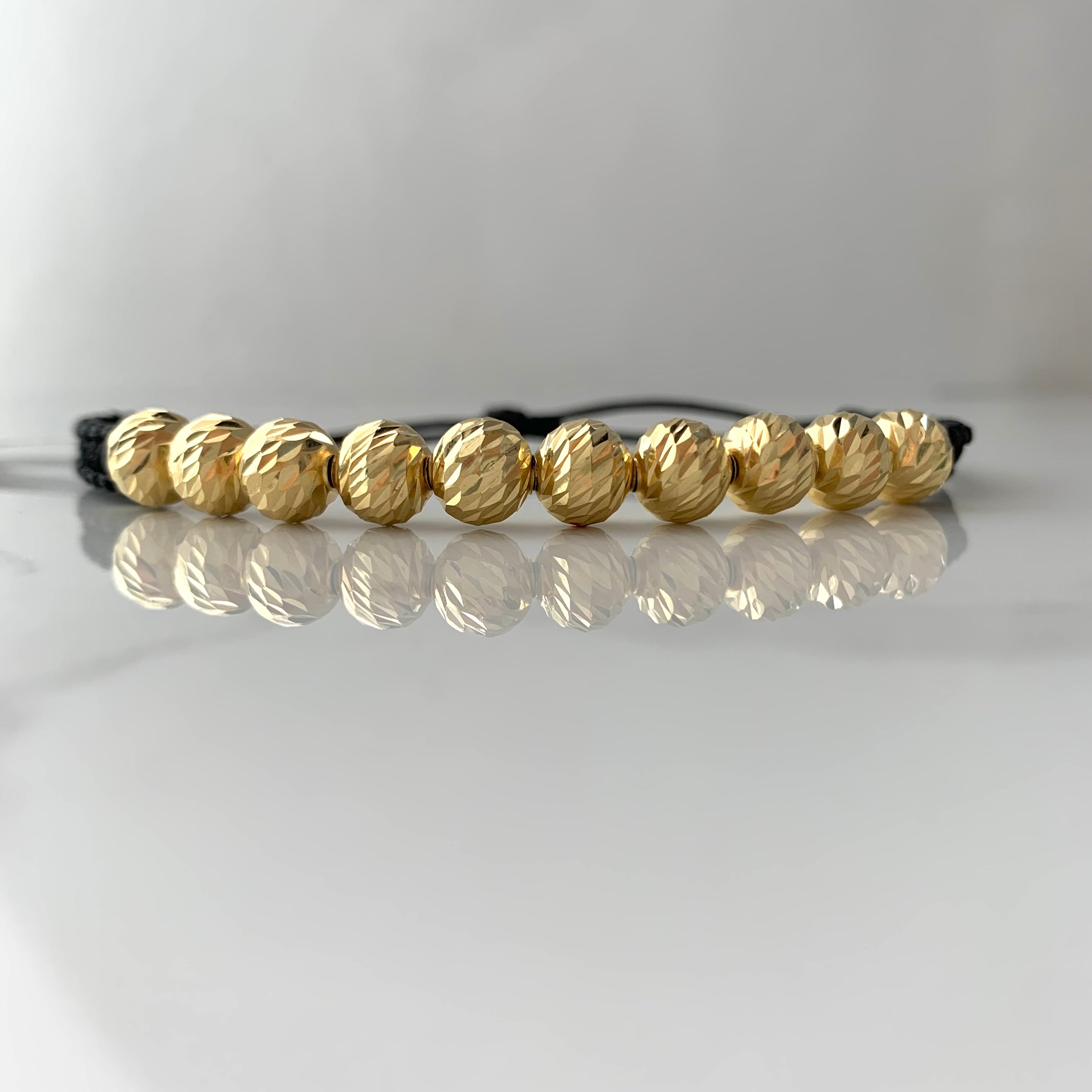 PULSERA TEJIDA NEGRA BOLA DIAMANTADA 8MM ORO AMARILLO 18K 3,75 GR BROCHE