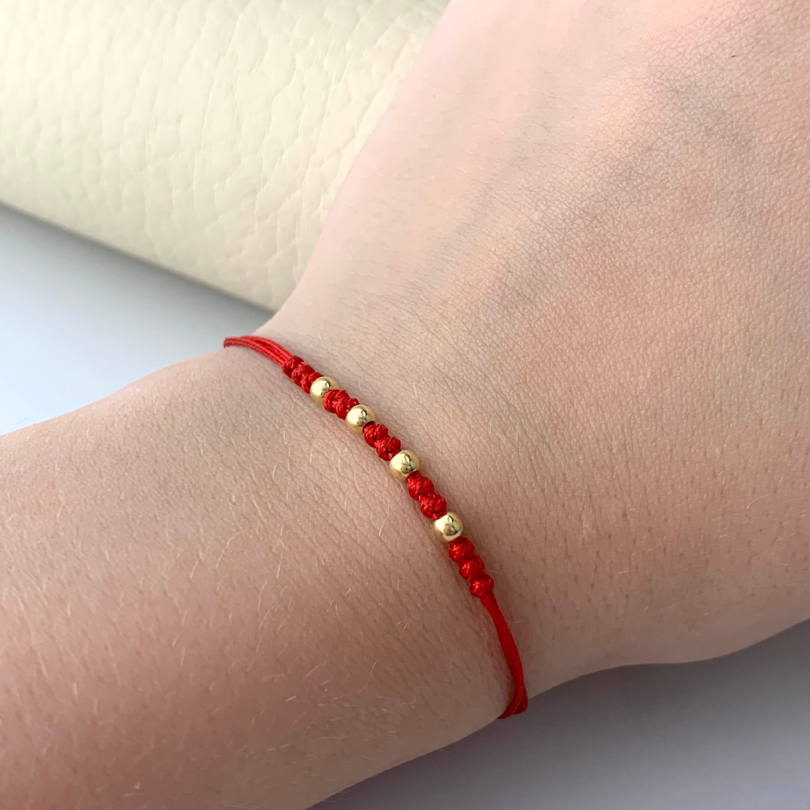 PULSERA TEJIDA ROJA BOLA LISA 3MM ORO AMARILLO 18K 0,2 GR BROCHE