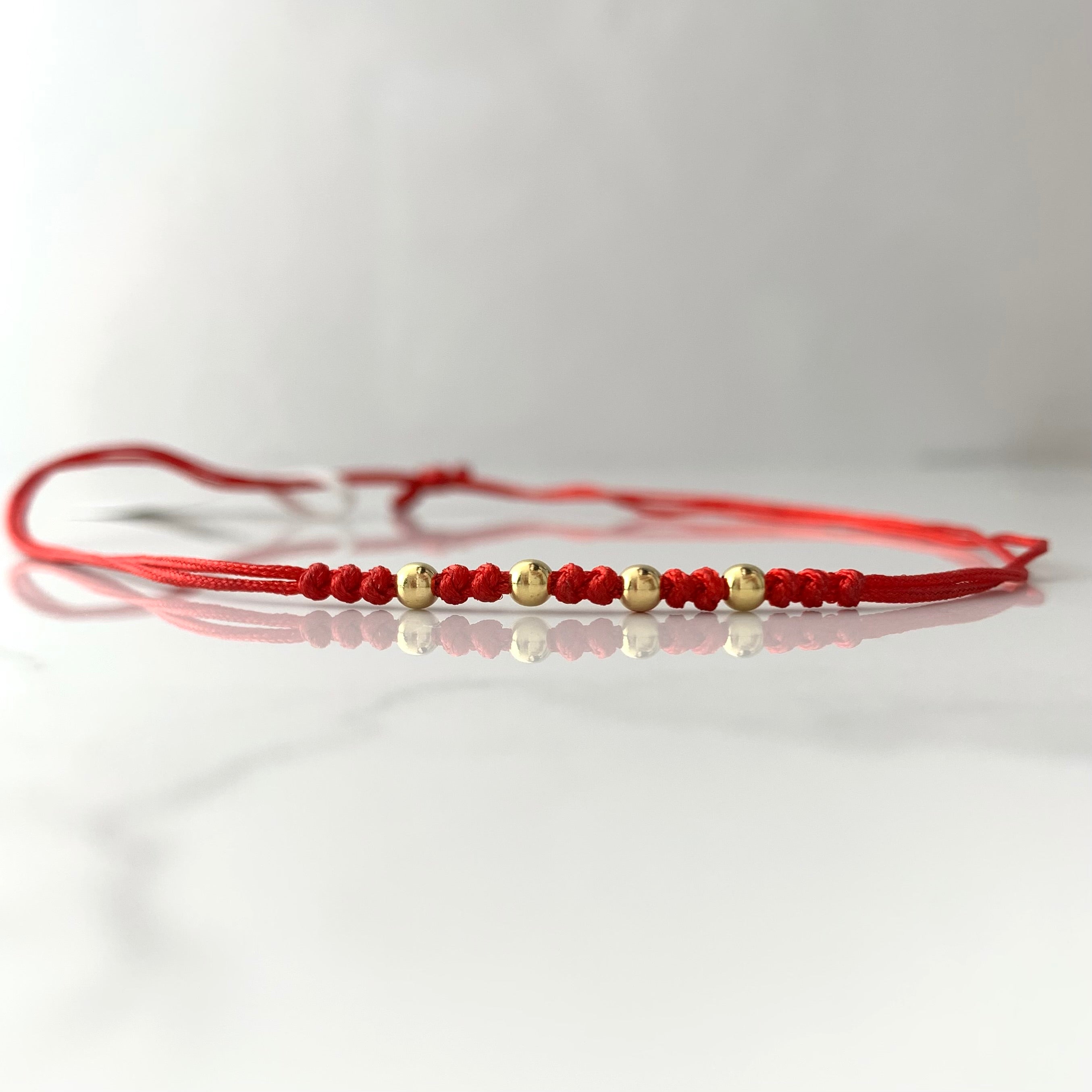 PULSERA TEJIDA ROJA BOLA LISA 3MM ORO AMARILLO 18K 0,2 GR BROCHE