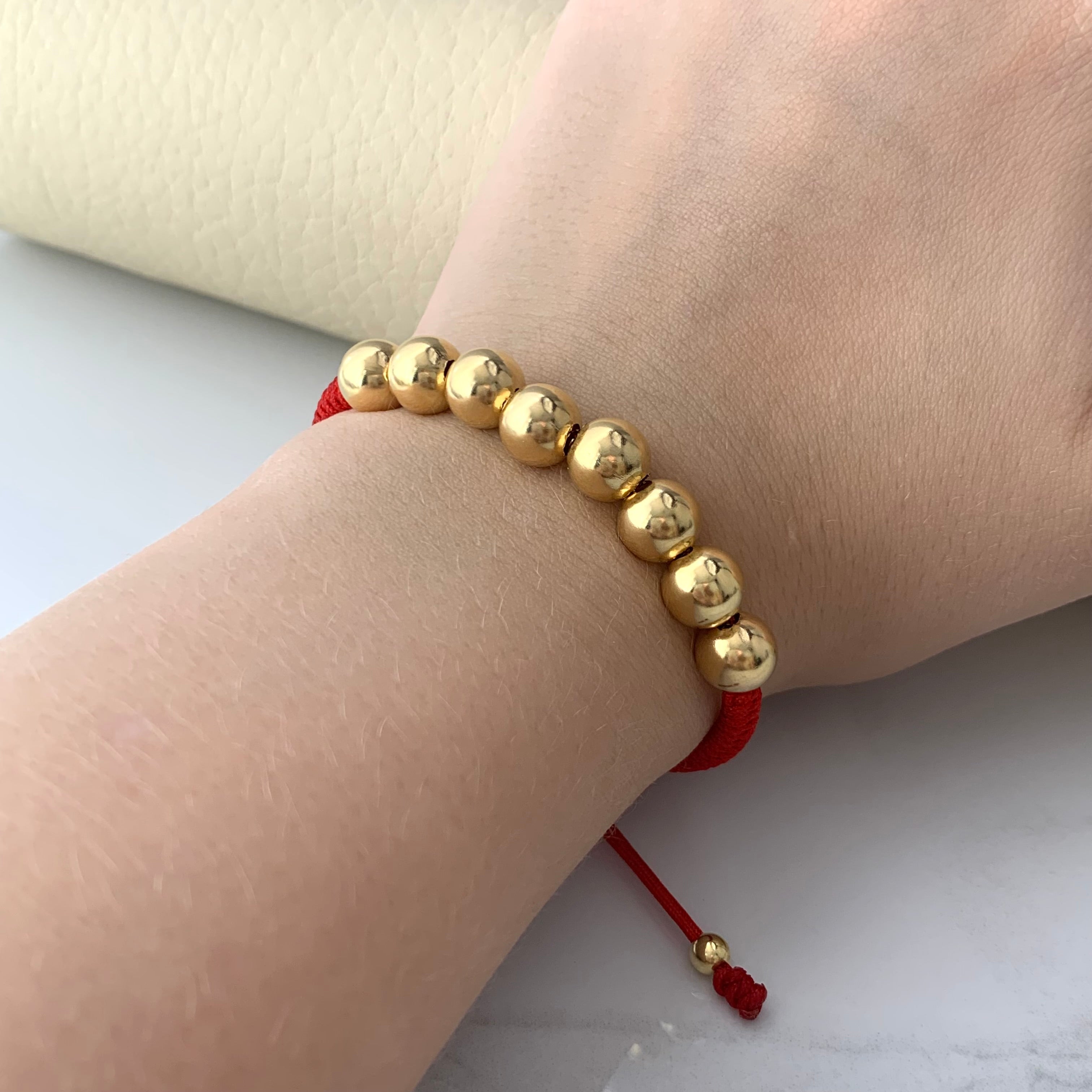 PULSERA TEJIDA ROJA BOLA LISA 8MM 4MM  ORO AMARILLO 18K 2,6 GR BROCHE